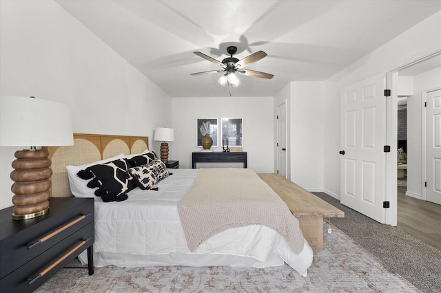 bedroom featuring ceiling fan and carpet floors