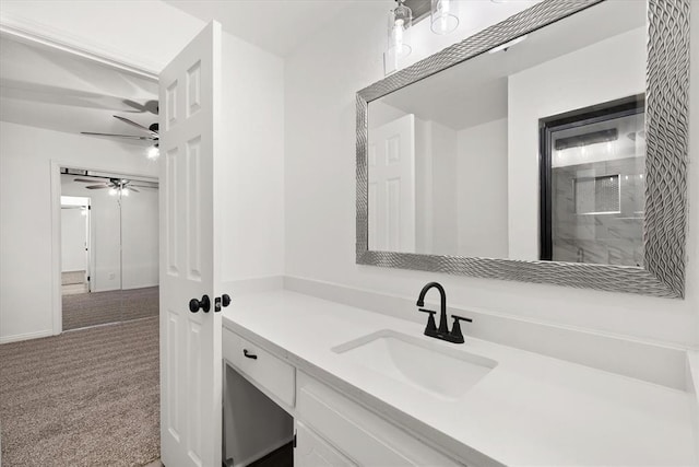 bathroom with ceiling fan, vanity, and a shower