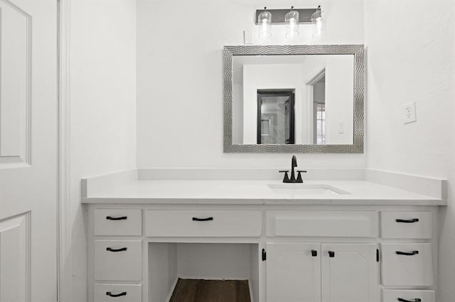 bathroom with wood-type flooring and vanity