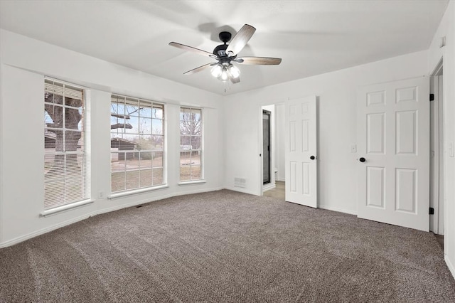 unfurnished bedroom featuring ceiling fan and carpet flooring