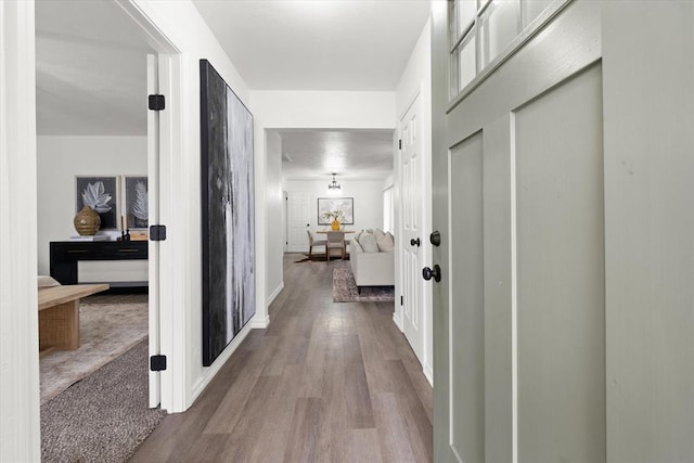 corridor featuring light hardwood / wood-style flooring