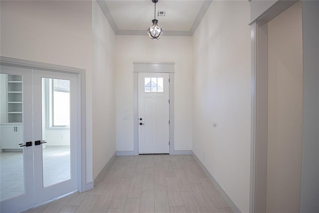 entryway featuring french doors and light hardwood / wood-style flooring