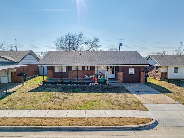 ranch-style house with covered porch and a front yard