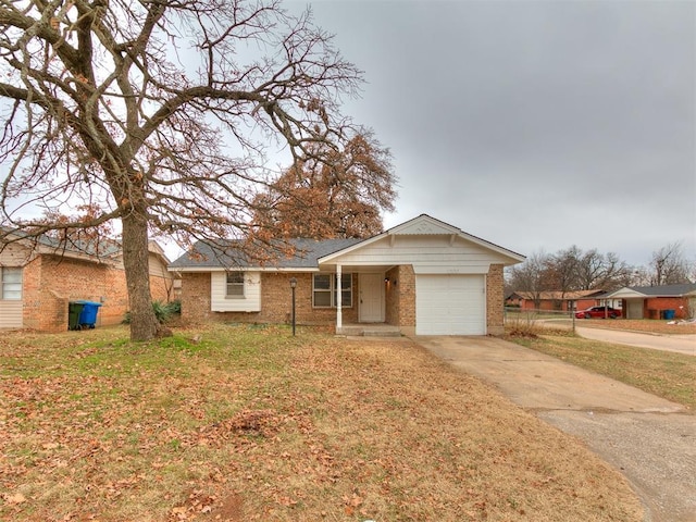 single story home with a garage and a front lawn