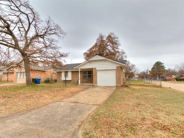 ranch-style home featuring a garage and a front lawn