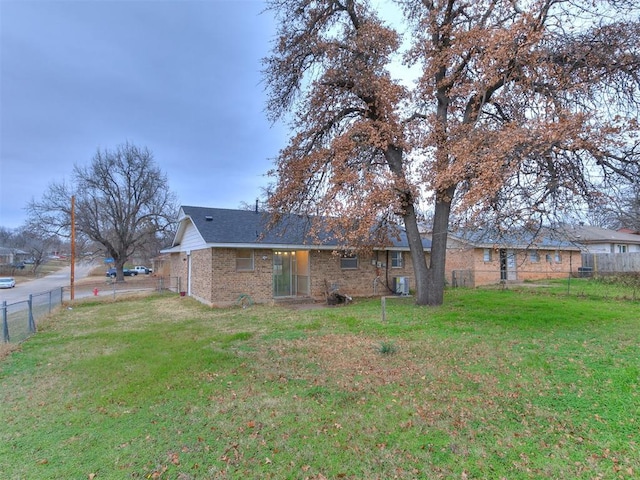 back of house with a yard