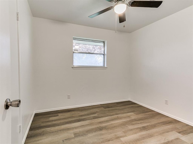 spare room featuring ceiling fan and wood-type flooring