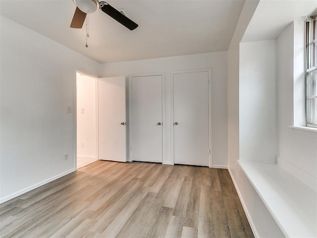 unfurnished bedroom featuring light hardwood / wood-style floors and ceiling fan