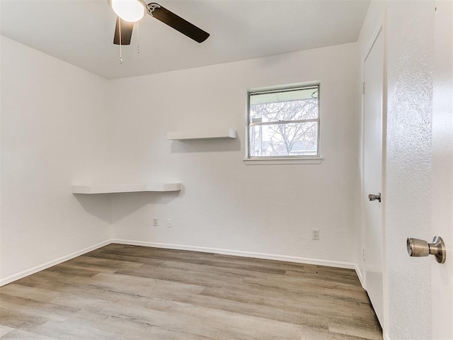 empty room featuring light hardwood / wood-style floors and ceiling fan