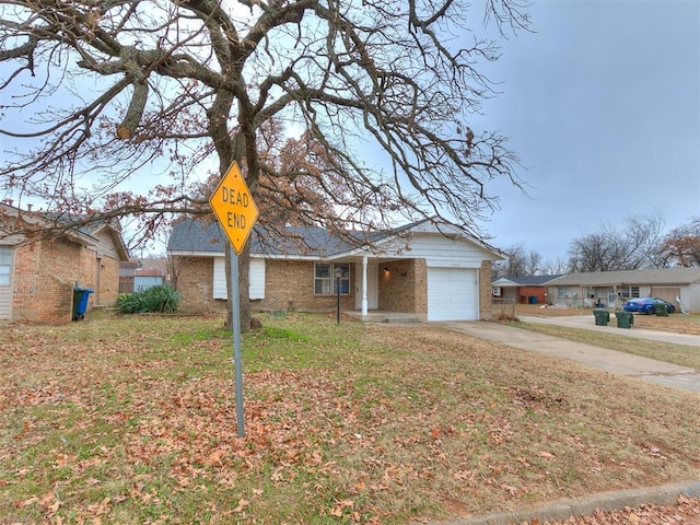 single story home featuring a front yard and a garage