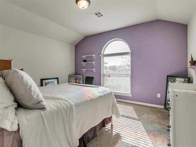 bedroom featuring carpet and vaulted ceiling