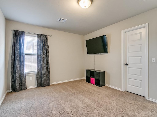 interior space featuring light colored carpet