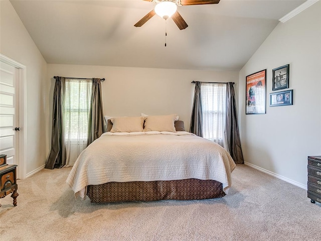 bedroom with ceiling fan, light carpet, and lofted ceiling