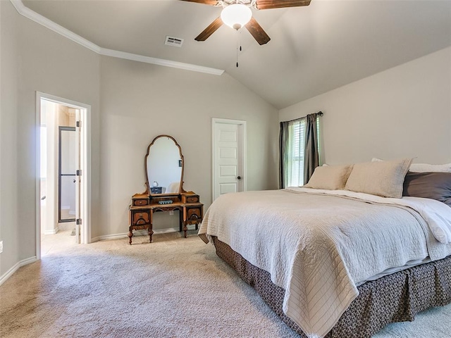 carpeted bedroom featuring ceiling fan, crown molding, and vaulted ceiling