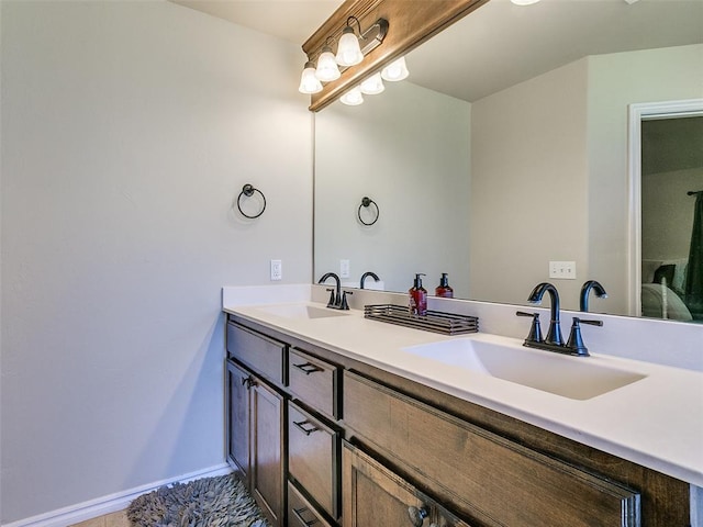 bathroom with tile patterned flooring and vanity