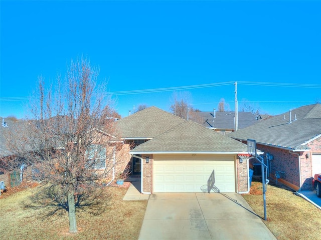 view of front of house with a front yard and a garage