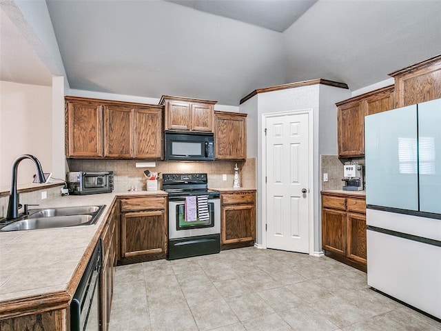 kitchen with tasteful backsplash, dishwashing machine, vaulted ceiling, sink, and stainless steel electric range oven