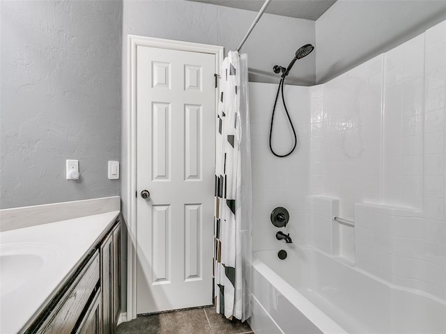 bathroom featuring tile patterned flooring, vanity, and shower / bath combination with curtain