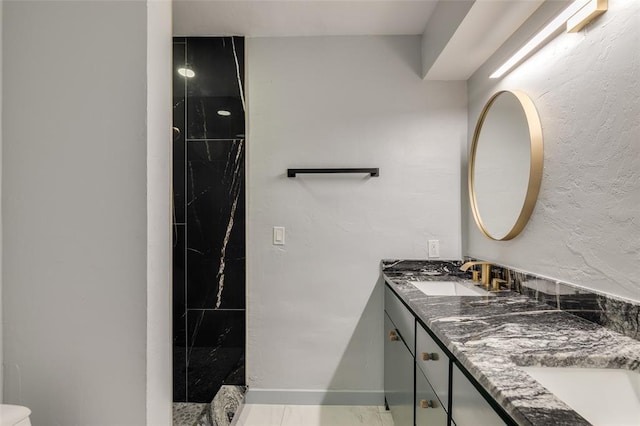 bathroom featuring vanity and walk in shower