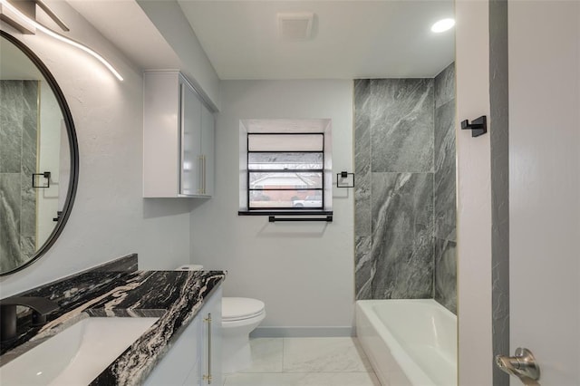 full bathroom with vanity, tiled shower / bath combo, and toilet