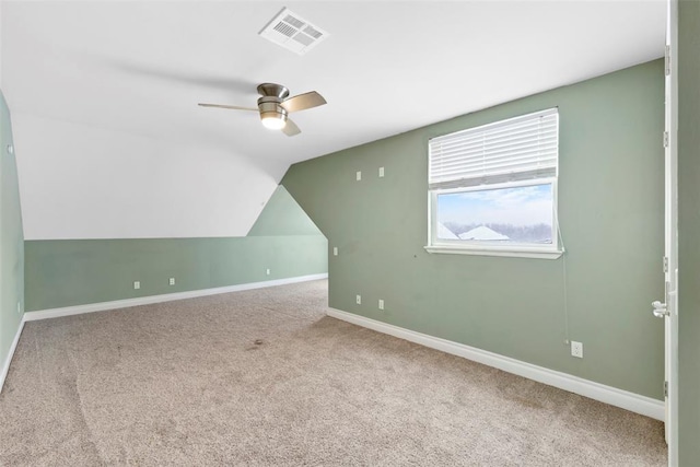 bonus room featuring ceiling fan, light colored carpet, and vaulted ceiling