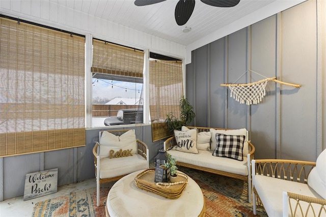 living area featuring ceiling fan