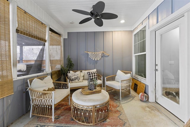 sunroom featuring ceiling fan