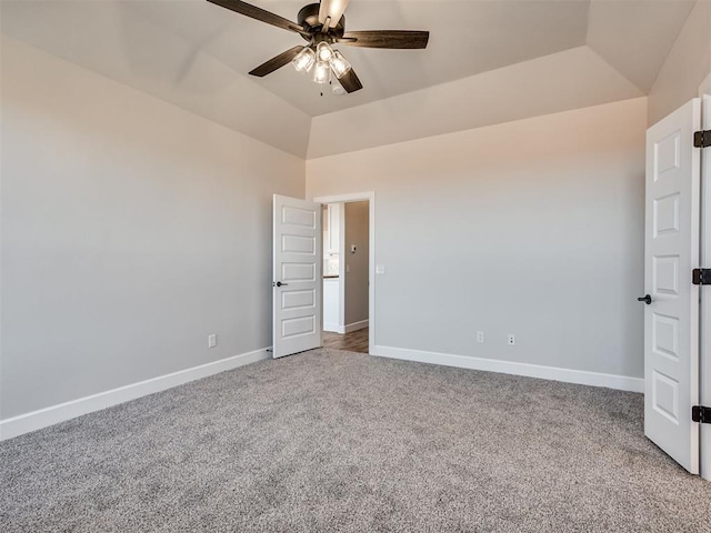 unfurnished bedroom with carpet floors, vaulted ceiling, and ceiling fan