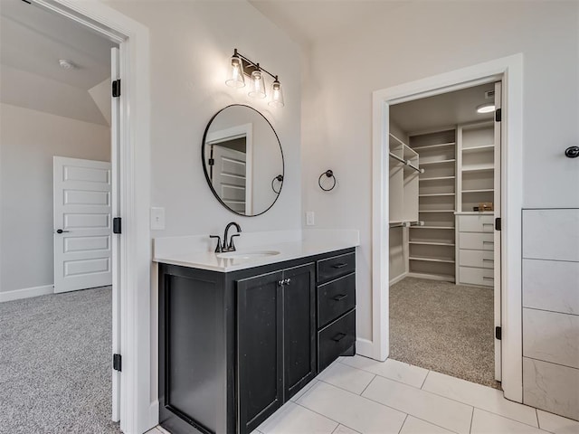 bathroom with tile patterned floors and vanity