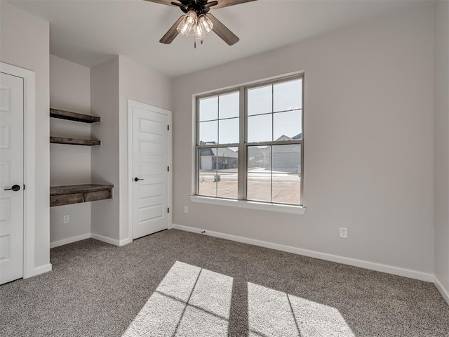 unfurnished bedroom with carpet flooring, ceiling fan, and a closet