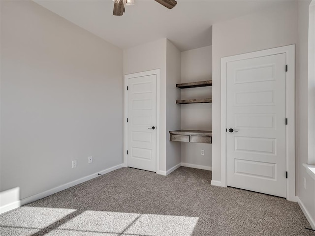 unfurnished bedroom with ceiling fan, light colored carpet, and a closet