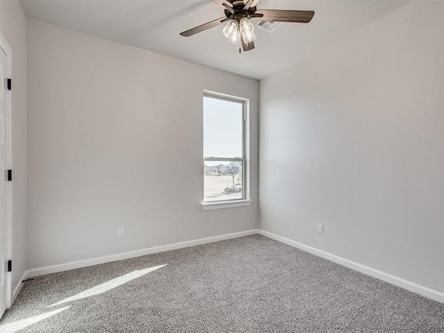 carpeted empty room featuring ceiling fan