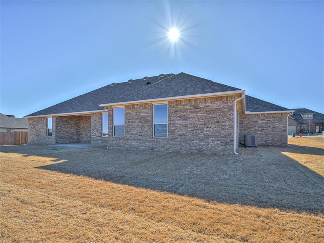 rear view of property featuring cooling unit