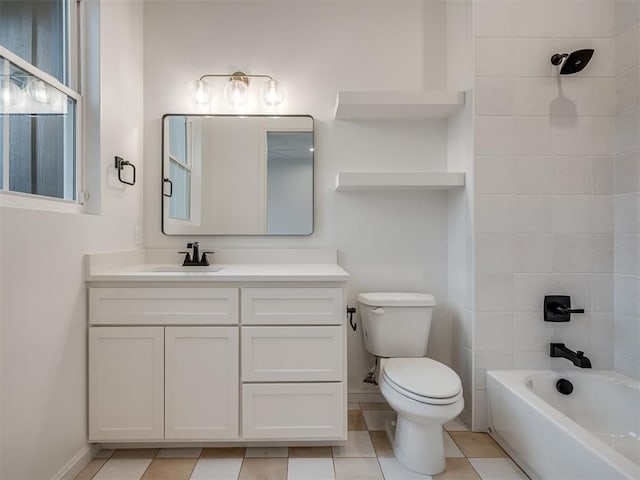 full bathroom featuring tile patterned floors, vanity, tiled shower / bath combo, and toilet