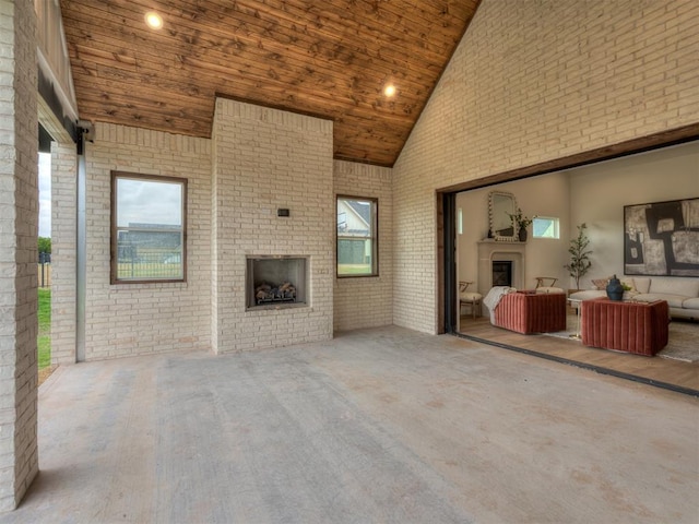 view of patio / terrace with an outdoor living space with a fireplace