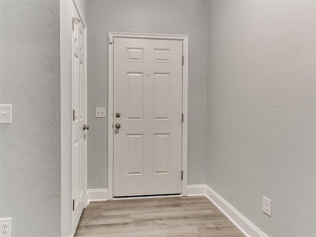 doorway with light hardwood / wood-style flooring