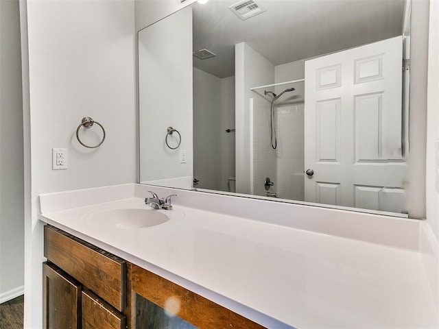 bathroom featuring vanity and tub / shower combination