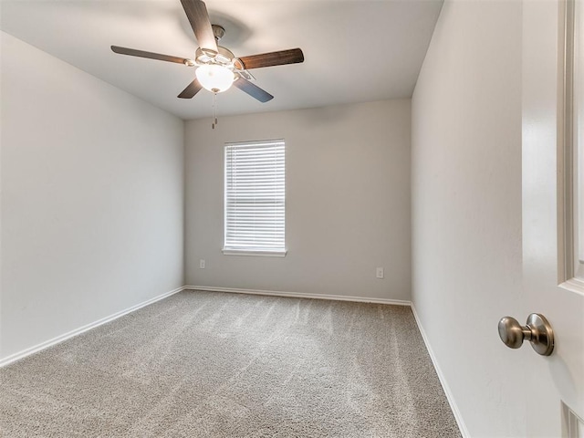 spare room with carpet flooring and ceiling fan