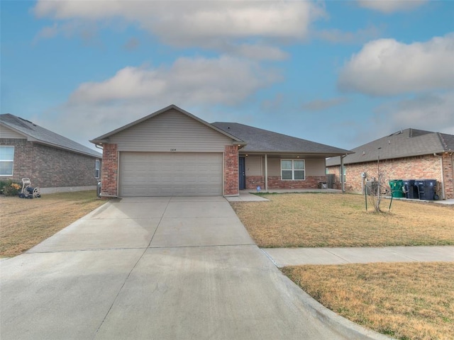 single story home featuring a front lawn and a garage