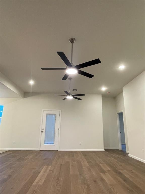 empty room with ceiling fan and hardwood / wood-style floors