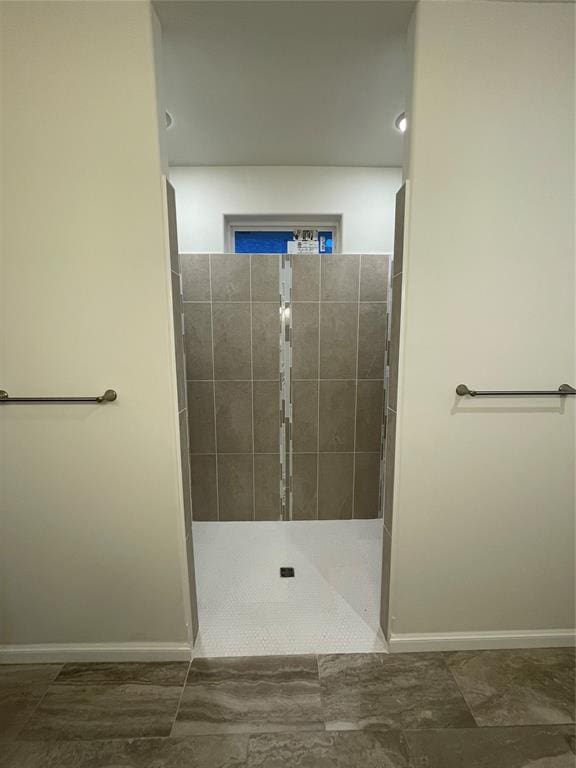 bathroom with tiled shower