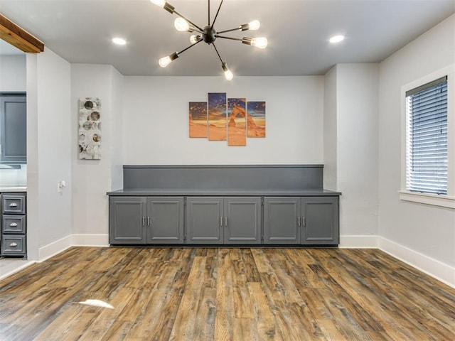 interior space featuring dark hardwood / wood-style floors and a chandelier