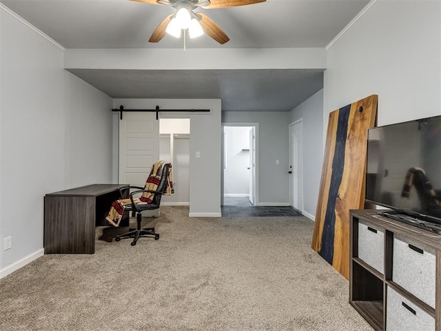 office featuring carpet flooring, ceiling fan, and a barn door