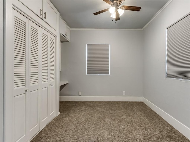 unfurnished bedroom with carpet, ceiling fan, ornamental molding, and a closet