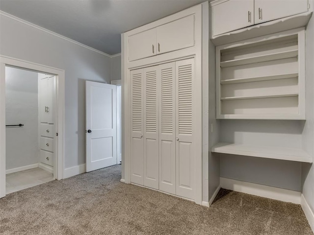 unfurnished bedroom featuring light colored carpet and ornamental molding