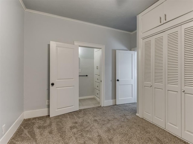 unfurnished bedroom with light carpet, a closet, and ornamental molding