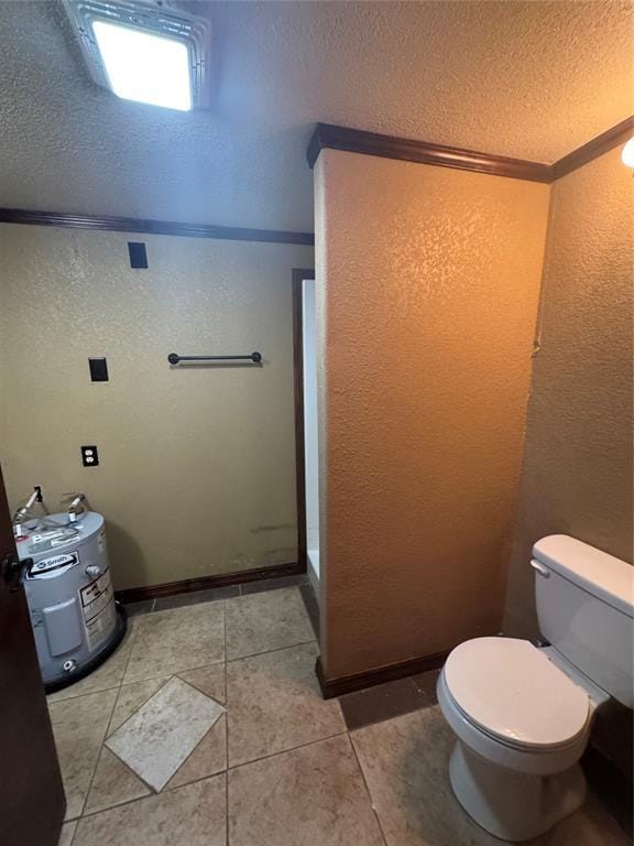 bathroom featuring tile patterned floors, a textured ceiling, and toilet