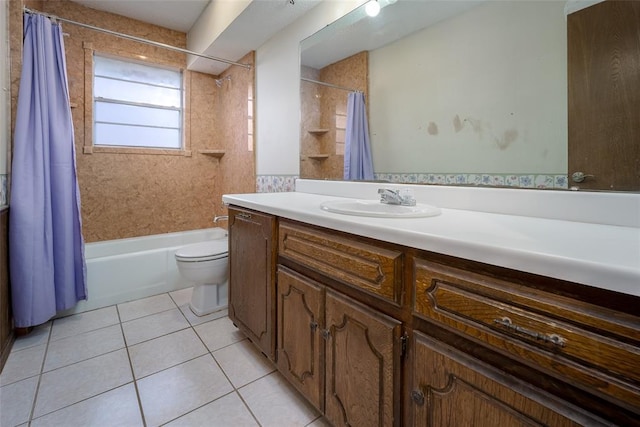 full bathroom with tile patterned floors, shower / tub combo with curtain, vanity, and toilet