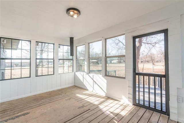 unfurnished sunroom with a wealth of natural light