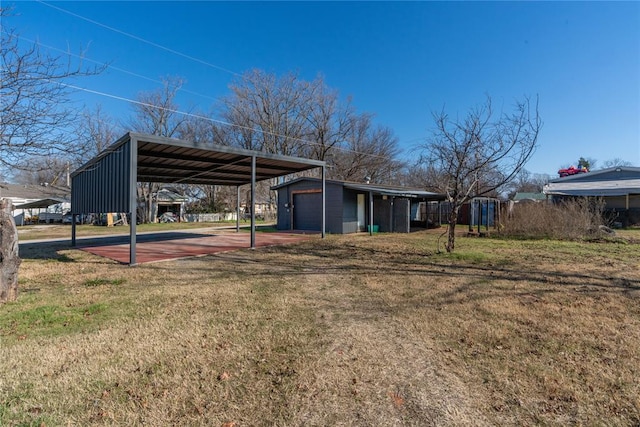 exterior space with an outbuilding, a garage, and a carport